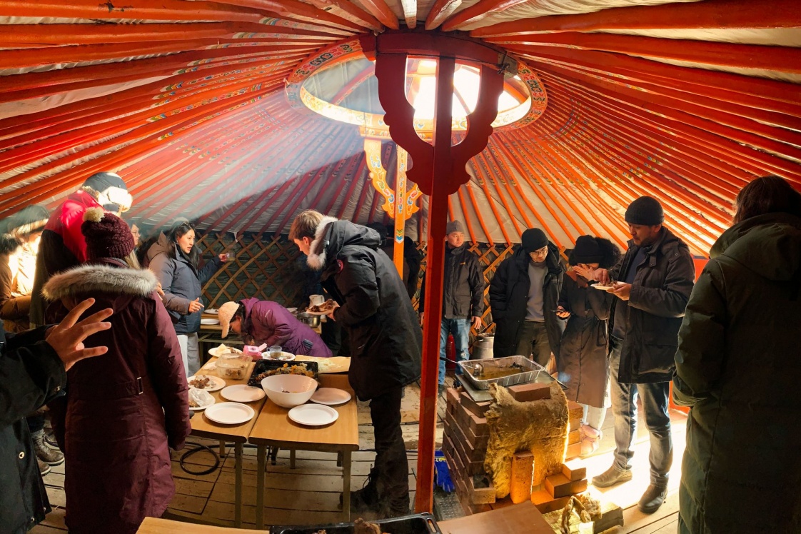 Students gather in a Mongolian ger around a coal-burning stove in the residential settlements known as the ger districts