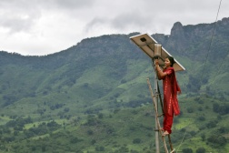 A solar engineer maintains the street lighting in her village of Tinginaput, India — a rural area not connected to the region’s main electrical grid. Credits: Photo: Abbie Trayler-Smith/Panos Pictures 