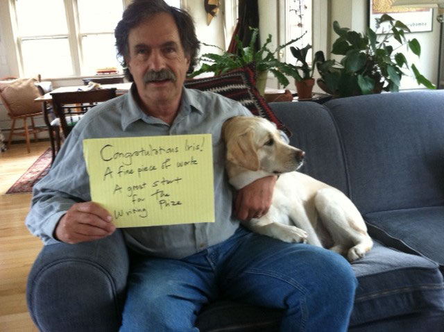 Professor James Howe, at home with his beagle, Bella