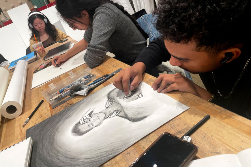 Senior Charles Williams, a computer engineering major, works on pieces he says depict stressors he was experiencing. “This class breathes back into you the creative and artistic expression that is too often lost as we grow up and mature,” he says. Credits: Photo: Allegra Boverman