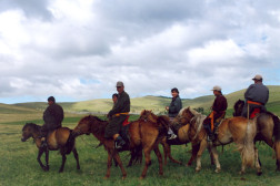 Horse riders in the steppes of Mongolia